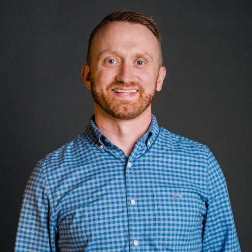 An experienced cybersecurity team leader in a professional office setting