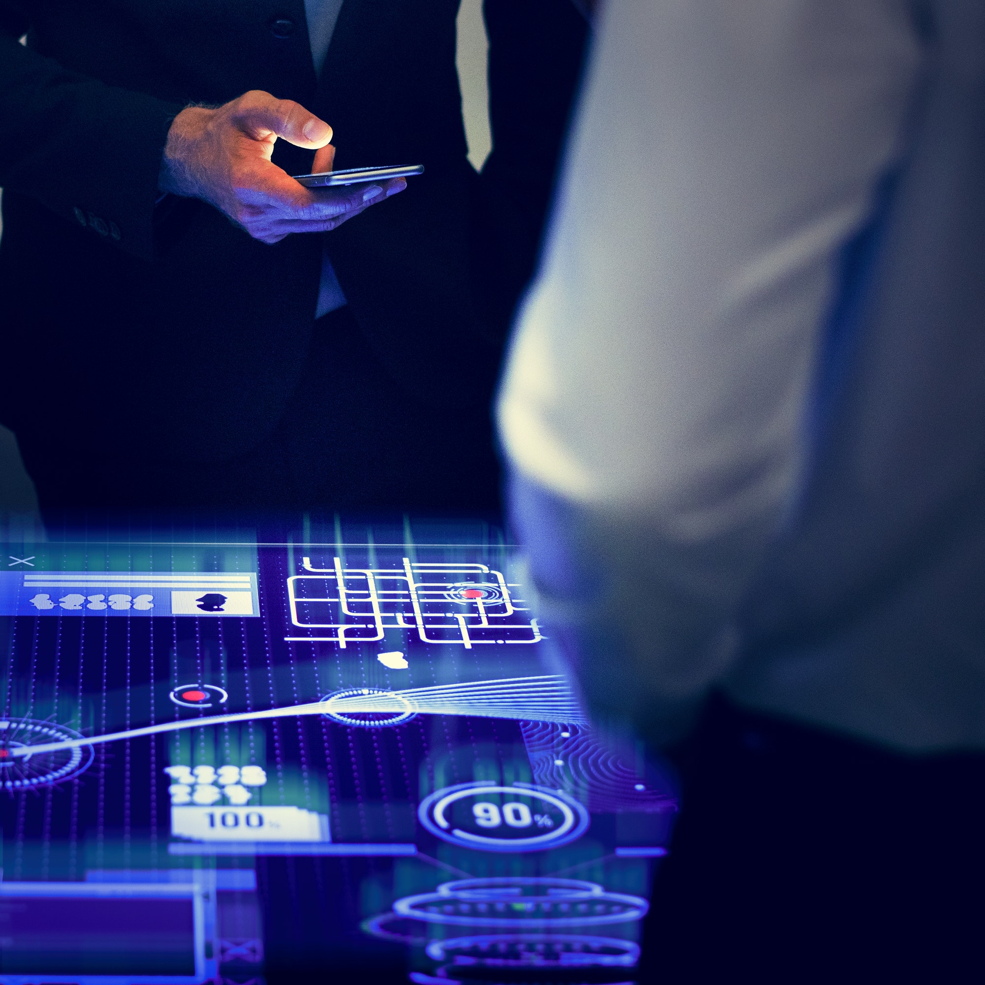 Business professional interacting with a futuristic holographic display projected from a smartphone. Partner with OMEX Cyber Security